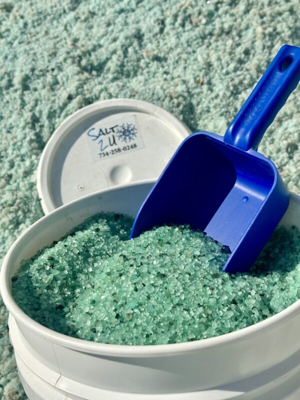 Premium Blend Ice Melt in a 5-gallon bucket, featuring green crystals for effective ice meltin