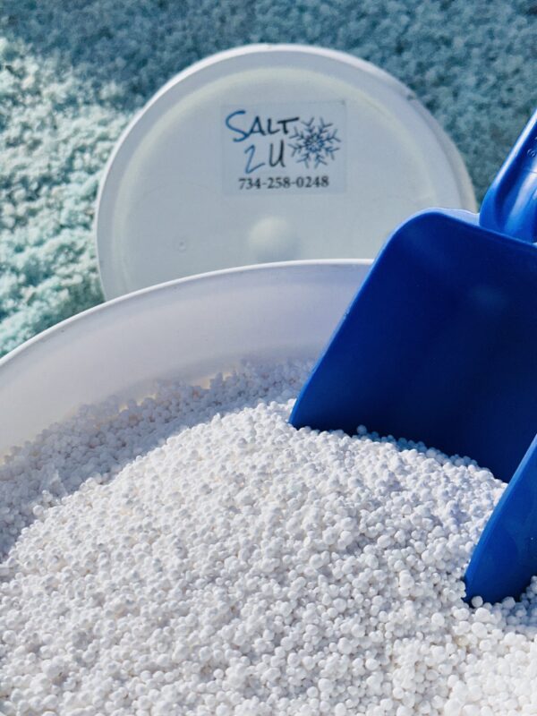 5-gallon bucket of Calcium Chloride Blend Melt, featuring round pellets designed to melt snow and ice quickly, even in extreme cold down to -20°F